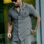 Two-piece premium black athletic tracksuit for men, moisture-wicking fabric for gym and sports.