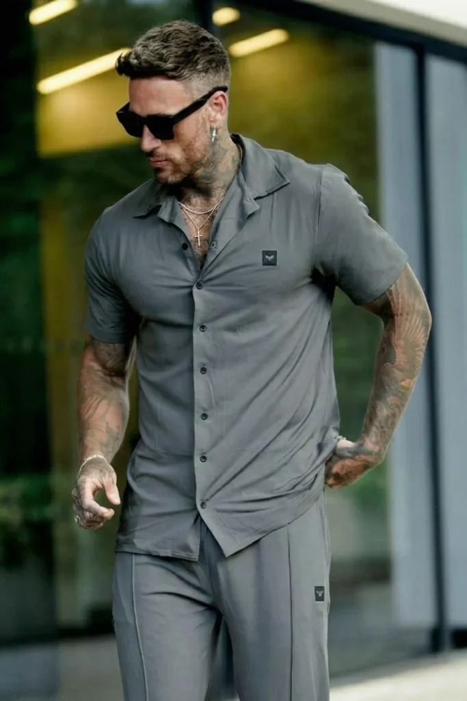Two-piece premium black athletic tracksuit for men, moisture-wicking fabric for gym and sports.