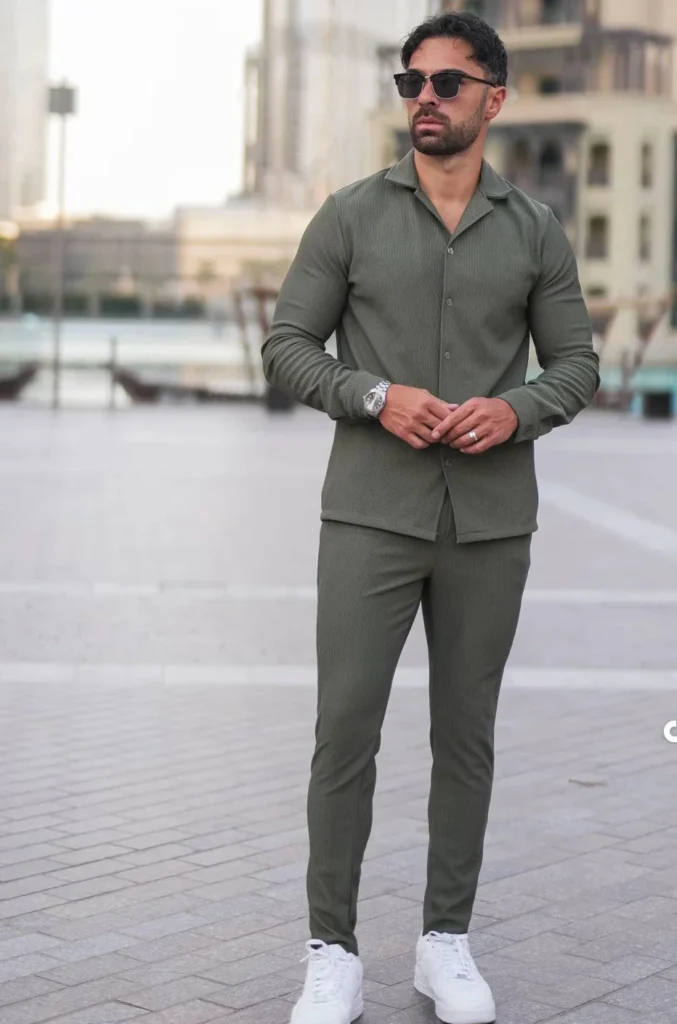 Two-piece premium black athletic tracksuit for men, moisture-wicking fabric for gym and sports.