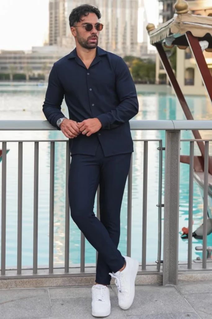Two-piece premium black athletic tracksuit for men, moisture-wicking fabric for gym and sports.