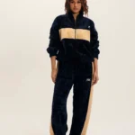 Two-piece premium black athletic tracksuit for men, moisture-wicking fabric for gym and sports.