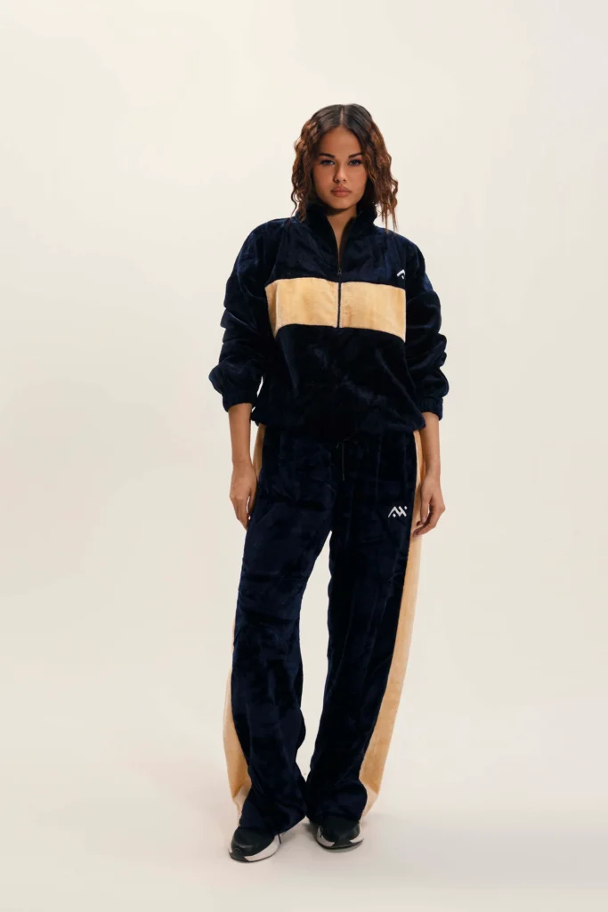 Two-piece premium black athletic tracksuit for men, moisture-wicking fabric for gym and sports.