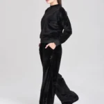 Two-piece premium black athletic tracksuit for men, moisture-wicking fabric for gym and sports.